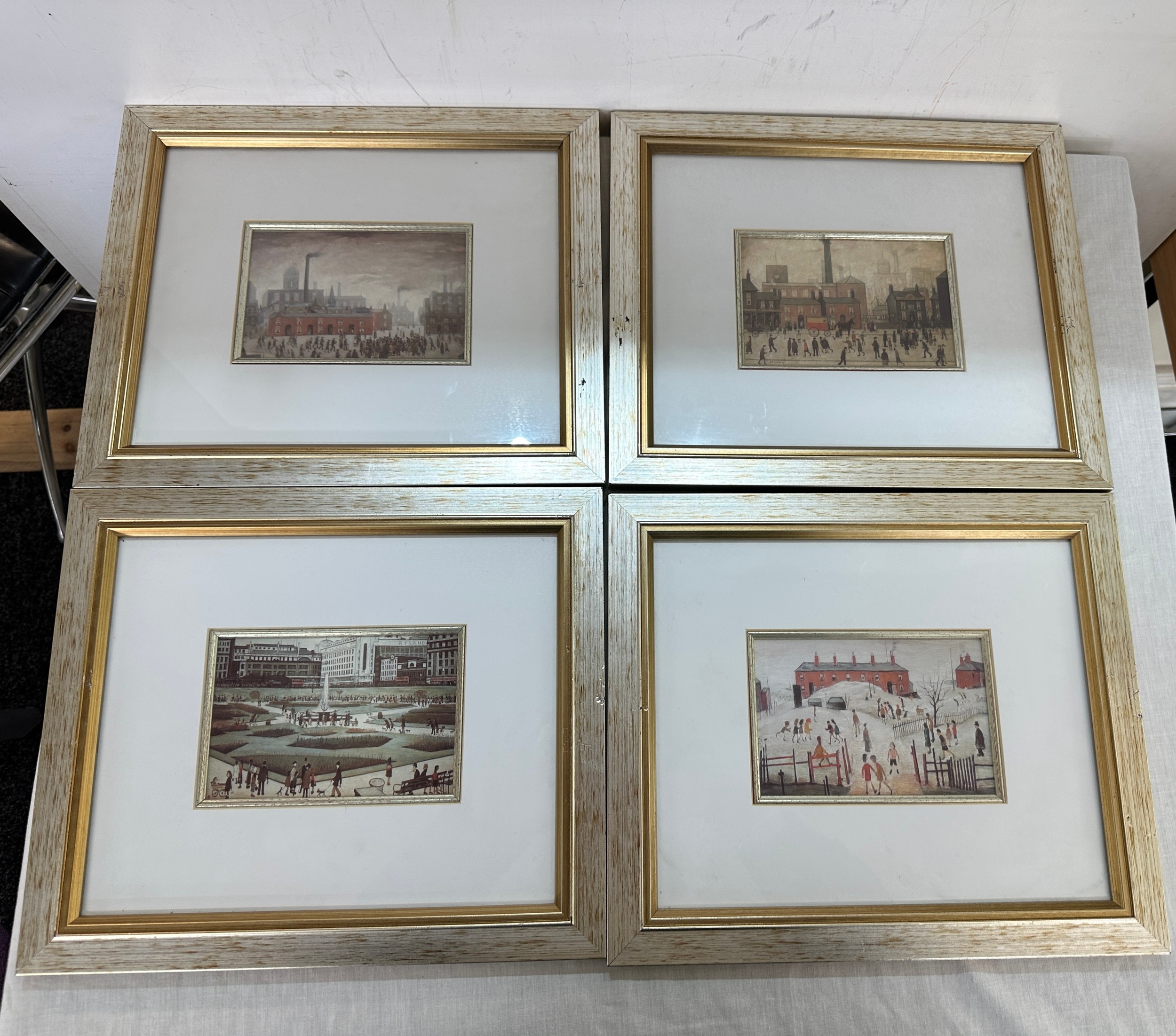 Four framed Lowry mini prints one signed- frames measures approx 14 inches wide by 11 inches long