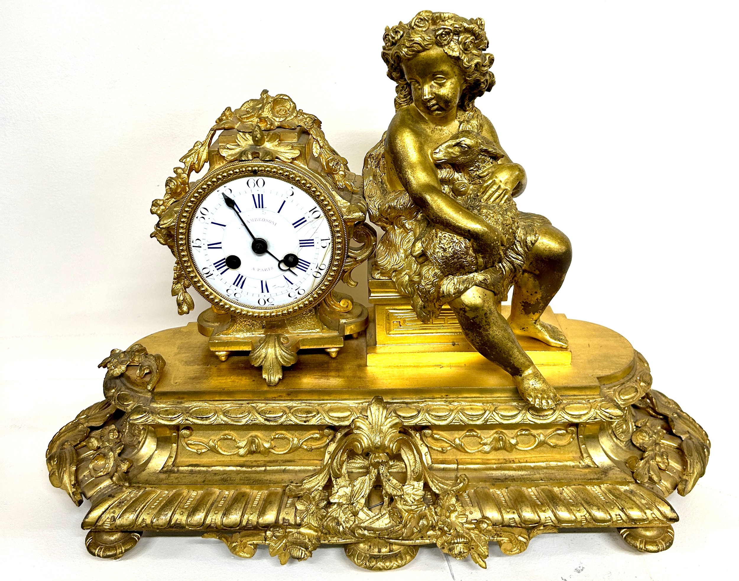 Vintage Ambrosoni guilted bronze mantel clock depicting cherubs, untested. Approximate measurements: