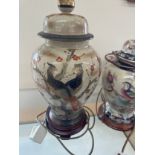 Two vintage hand painted oriental lidded jar lamps on wooden bases largest measures- 28 inches