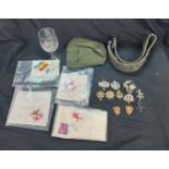 Selection of military items includes badges, WWII belt, Per ardua ad astra glass etc