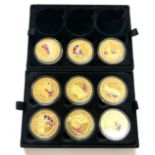 Selection of 9 commemorative gold plated one crown coins