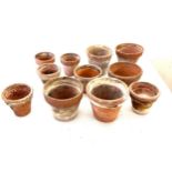 Selection of miniature terracotta plant pots largest measures approximately 6 inches tall