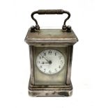 Small Vintage silver plated carriage clock the clock is ticking measures approx height 8cm by 6cm