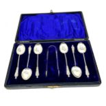 Boxed set of 6 silver tea spoons & sugar tongs