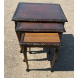 Mahogany nest of three tables with a glass top smaller table missing glass