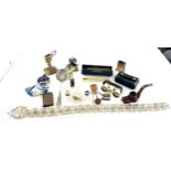 Tray of collectable items includes lighter, glass desk stand, novelty small clock etc