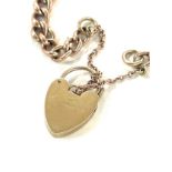 A gold chain with a heart shape locket 9 carat- weighs approx 9.6 grams