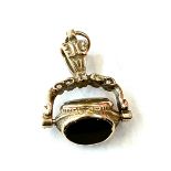 9ct gold revolving fob charm weighs approx 4.2 grams marked 375