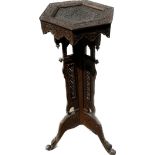 Vintage heavily carved Indonesia plant stand with elephant head legs measures approx 37 inches