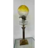 Antique brass collum base glass oil lamp complete with shade and funnel.