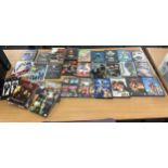 Large selection of assorted DVDS includes peter pan, Taboo, scooby doo etc