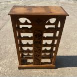 Large pine wine rack with carved front measures approx 40.5 inches tall by 27 inches wide and 12