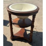 Victorian mahogany wash stand with porcelain basin measures approx 31 inches tall by 24 diameter