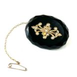 Victorian french jet mourning brooch with gold decoration and set with seed pearls measures approx 4