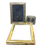 3 silver picture frames largest measures approx 21cm by 16cm