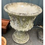 Large concrete ornate garden planter measures approx 24 inches tall by 21 inches diameter