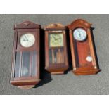 Three wall hanging clocks two with two key holes and other battery operated all untested. Largest