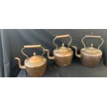 Three vintage copper kettles