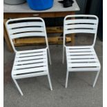 Two metal stacking garden chairs