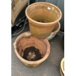 Three large terracotta plant pots largest measures approx 13 inches tall