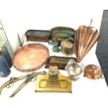 Selection of brass and copper ware includes a lion ended planter, novelty umbrella stand, dog nut