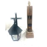 Outdoor cast iron lamp and a wood plane lamp