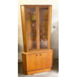 Mid century teak corner cabinet measures approximately 67inches tall 34 inches wide 20 inches depth
