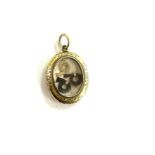 Antique victorian yellow metal memorial locket containing three locks of hair weighs approx 7.9