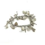 Vintage sterling silver charm bracelet weighs approx 60 grams