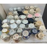 A large collection of porcelain shaving mugs various makers and designs