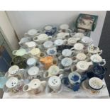 A large collection of porcelain shaving mugs various makers and designs