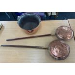 Two vintage copper bed warming pans and a copper jam pan