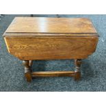 Small drop leaf oak table measures approx with leaf down 56 inches wide by 25 inches tall