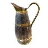 Large vintage brass bound water jug measures approximately 23 inches tall