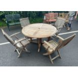 Folding teak table and four chairs from The Chilsworth Collection measures approx 52 diameter by
