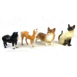 Four porcelain animal figures to include a Beswick horse and others Damage to horses ear