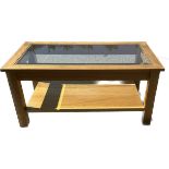 Modern oak and glass coffee table measures approx 18.5 inches tall by 39 inches long and 21 inches