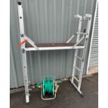 Aluminium decorators ladder and a hose