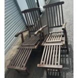 Two teak wooden folding deck chairs