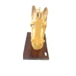 Moulded horse figure on a wooden base measures approximately