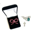 Silver celtic cross pendant with a Scottish thistle enamel brooch and a stone set bow brooch