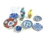 Selection of oriental pottery includes plates, vases, miniature dallah etc