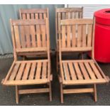 Set of four teak folding garden chairs