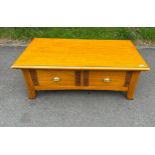 Two drawer elm coffee table measures approx 17 inches tall by 48 inches long and 26 inches wide