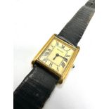 Vintage gents Movado gold tone tank wrist watch hand winding the watch is ticking black leather