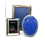 3 silver picture frames largest measures approx 22cm by 16cm