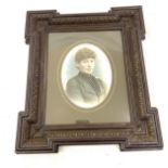 Antique framed painting on glass depicting a young boy, frame measures approximately 17 inches