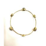 Arts and crafts yellow metal bangle set with head stones gross weight 11.5grams