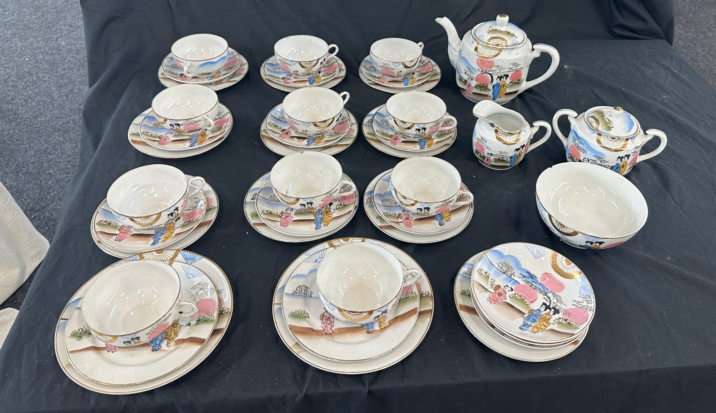 Oriental hand painted tea service with marks to base to include 11 cups complete cups and saucers,