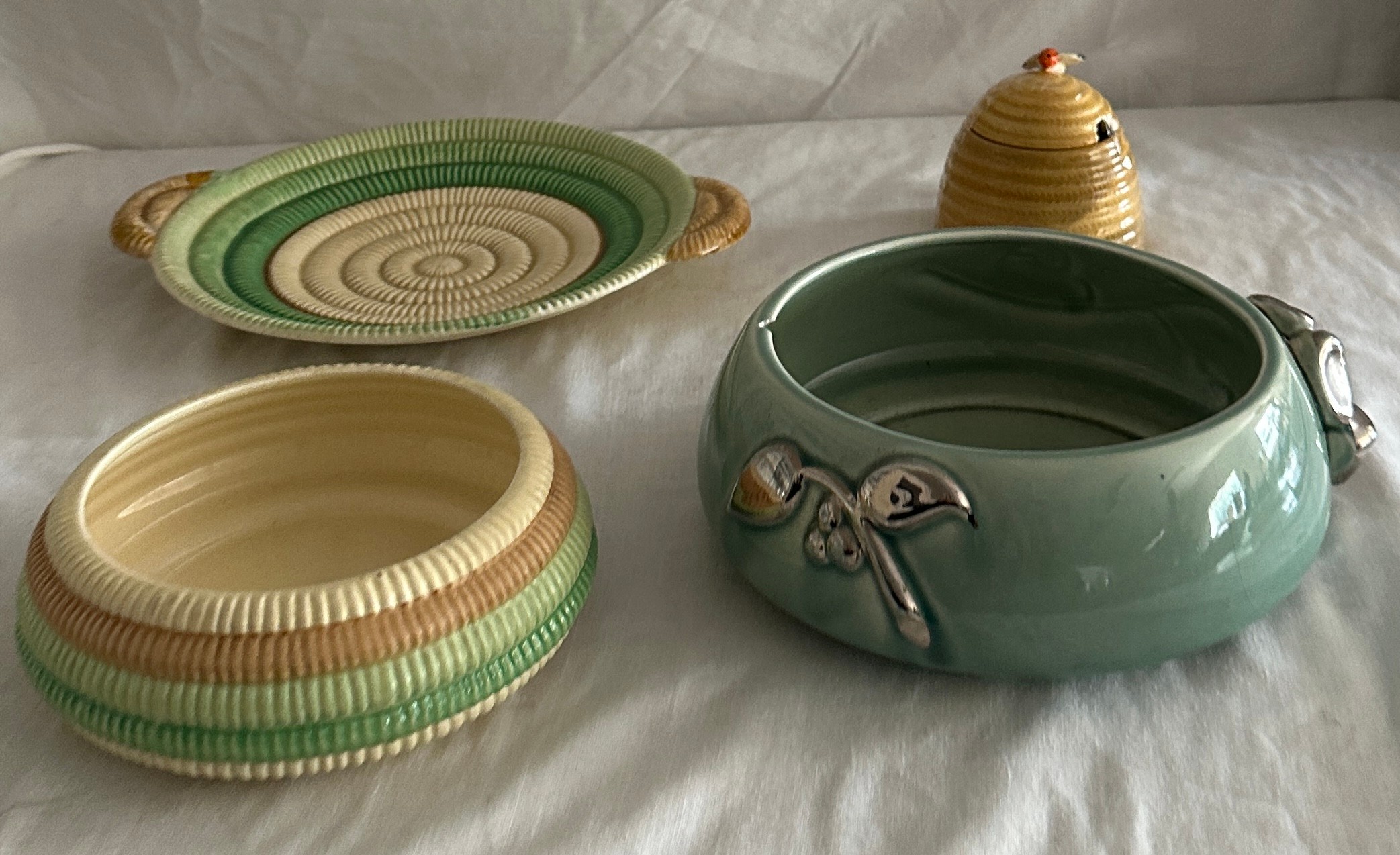 Selection of Clarice Cliff items to include a honey pot, bowl and plate